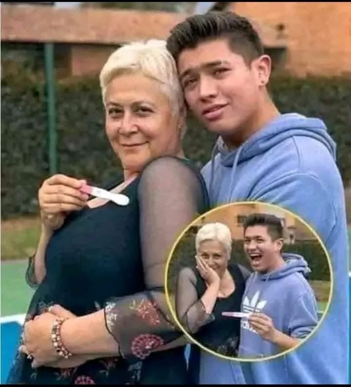Mujer feliz sosteniendo prueba de embarazo